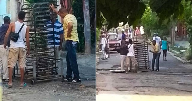 Trasladan bandejas de pan sin hornear por calles de Santiago de Cuba