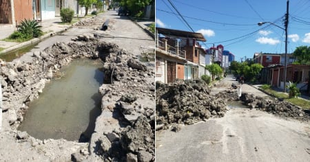 Dos motoristas a punto de caer en hueco con aguas negras en una calle de Santiago de Cuba