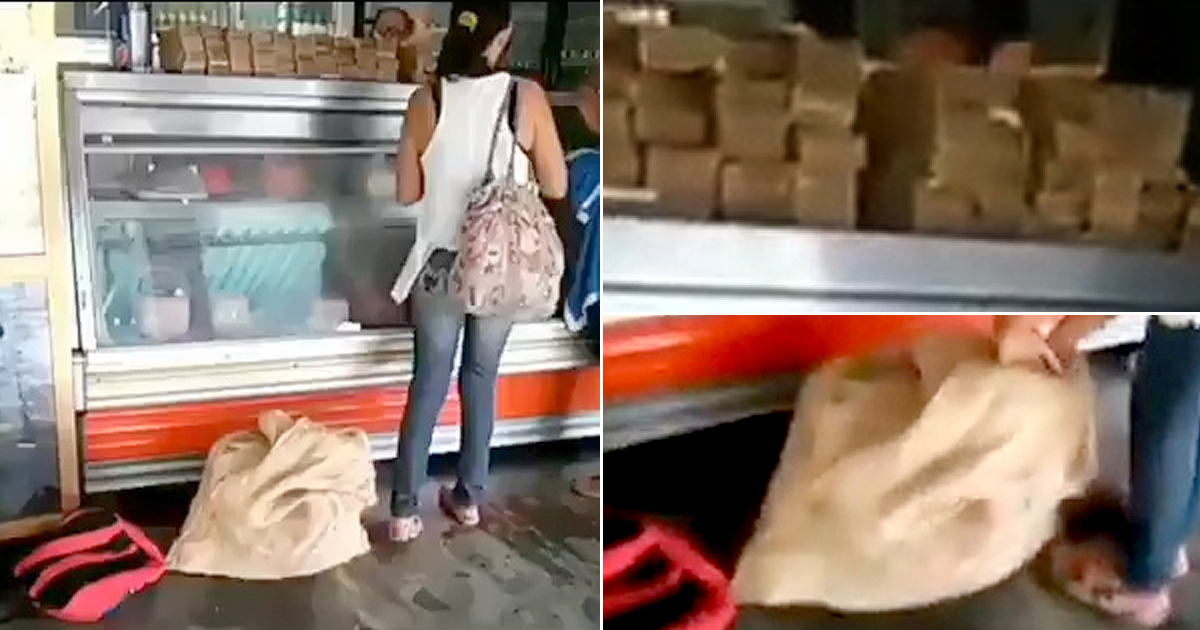 Mujer comprando en una tienda de Venezuela con un saco de billetes © Facebook / Henrique Capriles