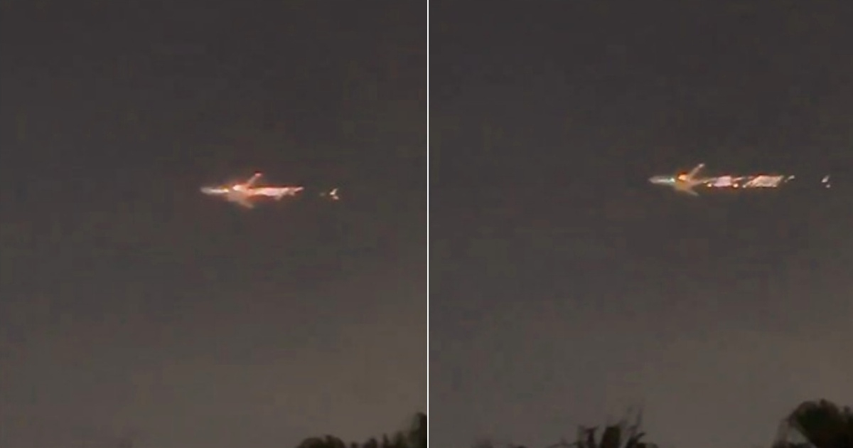 A plane flying over Miami with a burning engine