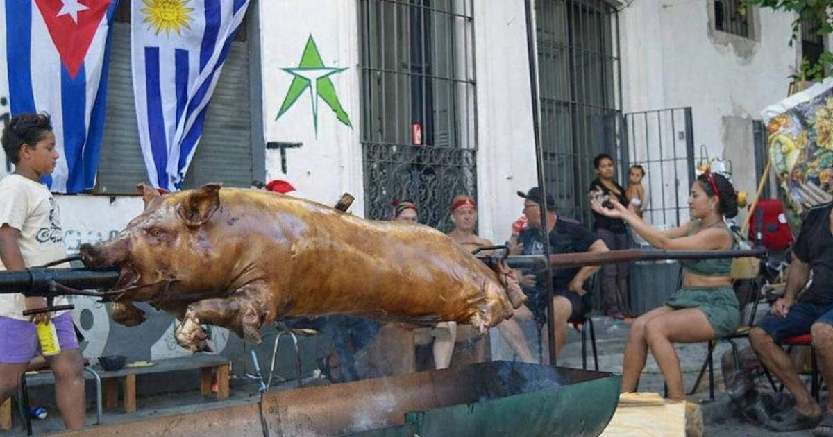Cubans in Montevideo Roast Whole Pig on Street for New Year's Celebration, Sparking Debate