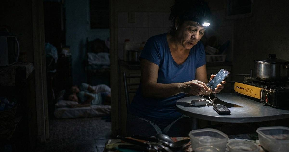 Blackouts force a Cuban woman to cook at three in the morning to take advantage of the electricity