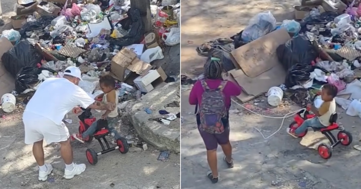 Mawell gifts a toy motorcycle to a 3-year-old boy who accompanies his parents while they collect trash