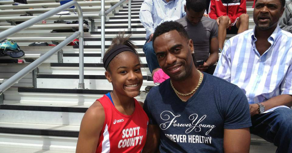 Tyson Gay y su hija Trinity abrazados en una imagen de archivo. © kentucky.com